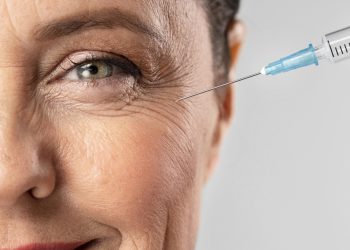 smiley-elder-woman-using-injection-her-eye-wrinkles